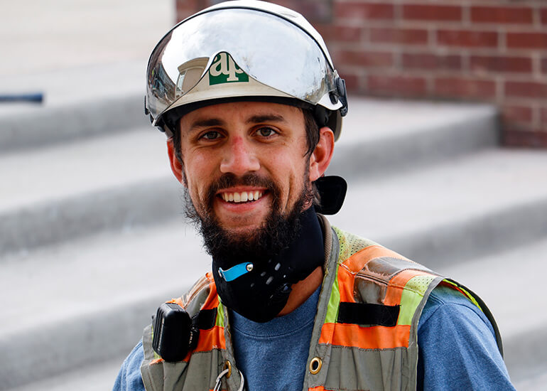 Man with a hard hat and construction vest
